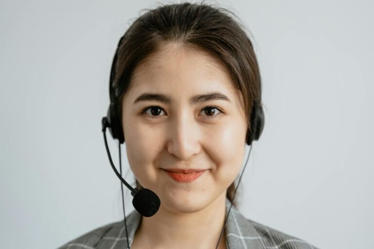 Portrait of a smiling customer service representative with a headset.